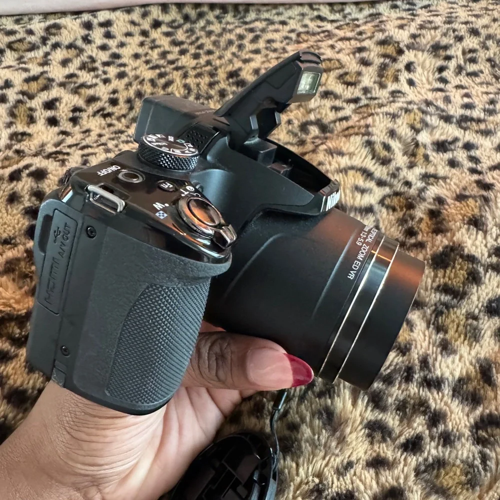 Nikon Black Camera with White Accessories
